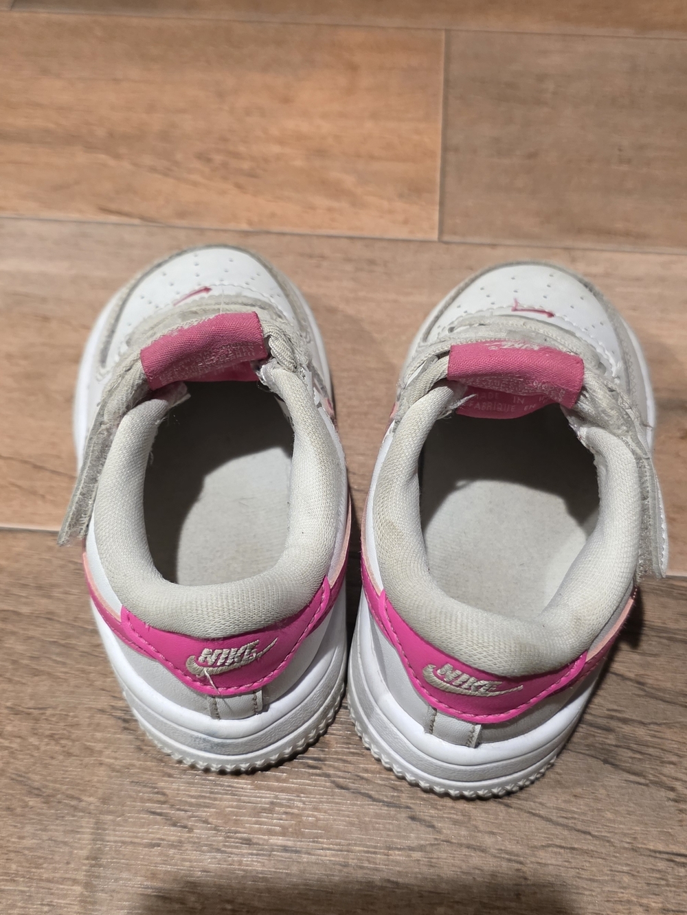 Nike Kids White Sneakers with Pink Accents